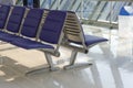 Row of purple chair decoration at airport terminal waiting area interior for modern building Royalty Free Stock Photo