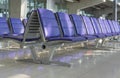 Row of purple chair interior at airport terminal waiting area decoration for modern building Royalty Free Stock Photo