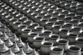 Row of raw clay pots and lid on shelf in process waiting for burn in charcoal kilns Royalty Free Stock Photo