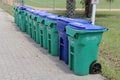 Row of Recycle Bins and Garbage Can