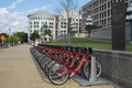 Row of Red Bicycles Used in the Capital Bikeshare Program Resting on the sidewalk #2