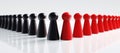 Red and black pawns on a white background Royalty Free Stock Photo