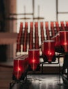 A row of Red Candles Inside a church Royalty Free Stock Photo