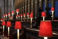 Row of red candles in the interior of Westminster Abbey, UK