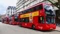 Row of red double decker London buses in city waiting on street Royalty Free Stock Photo