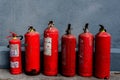 A row of fire extinguishers against the wall Royalty Free Stock Photo
