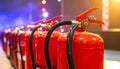 Row of red fire extinguishers indoors Royalty Free Stock Photo