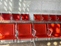 A row of red leather chairs are empty in a waiting room Royalty Free Stock Photo