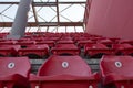 A row of red plastic chairs on a stadium Royalty Free Stock Photo