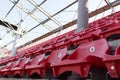 A row of red plastic chairs on a stadium Royalty Free Stock Photo