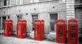 Row of red telephone boxes in London