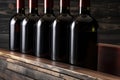 Row of red wine bottles on a wooden shelf, created with generative AI Royalty Free Stock Photo