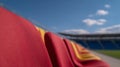 A row of red and yellow seats in a stadium Royalty Free Stock Photo