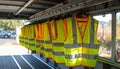 Row of reflective safety vests hanging Royalty Free Stock Photo