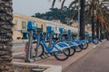 Row of rental Velobleu bikes parked on The Promenade des Anglais in Nice, France