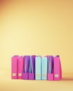 Row of Ring Binder Documents in Pink Purple Blue Beige Studying Back to School Concept Royalty Free Stock Photo