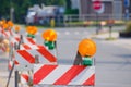 Row of Road Traffic Barricades with Yellow Lights