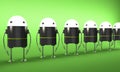 Row of robots with glowing heads, perspective view Royalty Free Stock Photo