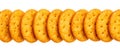 Row of round golden crackers on white background Royalty Free Stock Photo