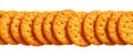 Row of round golden crackers on white background Royalty Free Stock Photo