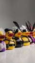 A row of rubber ducks with different costumes lined up, AI Royalty Free Stock Photo