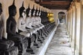 Row of Sacred Buddha statue Royalty Free Stock Photo