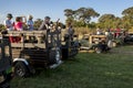 A row of safari jeeps loaded with tourists in Sri Lanka.