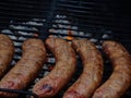 Row of sausages on a barbaque