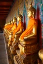 A row of seated Buddhas at the temple Royalty Free Stock Photo