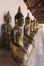 A row of seated Buddhas at a temple Royalty Free Stock Photo