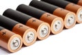 A row from seven finger-type batteries of the AA size on a white background