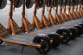 Row of shared Electric Kick Scooters or e-steps for rent in Melbourne, Australia