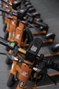 Row of shared Electric Kick Scooters or e-steps for rent in Melbourne, Australia