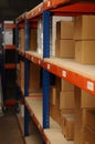 Row of shelves with boxes on Royalty Free Stock Photo