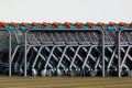 Stacked steel shopping carts in a row with white background