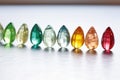 row of shiny rough gemstones placed on a marble background