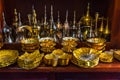 Row of shiny traditional coffee pots and lamp Royalty Free Stock Photo