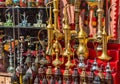 Row of shiny traditional coffee pots and lamp Royalty Free Stock Photo