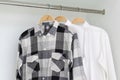 Row of shirts hanging in white wardrobe Royalty Free Stock Photo