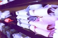 Row of shirts on shelfs in men clothing store Royalty Free Stock Photo