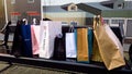 Row of shopping bags designer brands