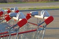 Row of shopping trolleys or carts in supermarket Royalty Free Stock Photo