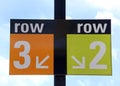 Row 2 and 3 sign with blue sky in background Royalty Free Stock Photo