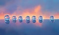 A row of six clear glass spheres on a blue surface Royalty Free Stock Photo