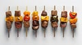 a row of skewered meats and peppers on sticks Royalty Free Stock Photo