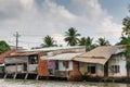 Row of slum-like houses along Kinh 28 canal in Cai Be, Mekong Delta, Vietnam