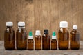 Row of small bottles with medicinal solution