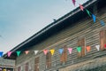 Row of small color flags hanging in the street and decorate the Royalty Free Stock Photo