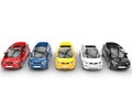 Row of small electric cars - various colors