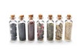 Row of small glass bottles with different spices Royalty Free Stock Photo